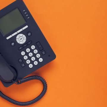1-voip features voip service black voip phone on orange background